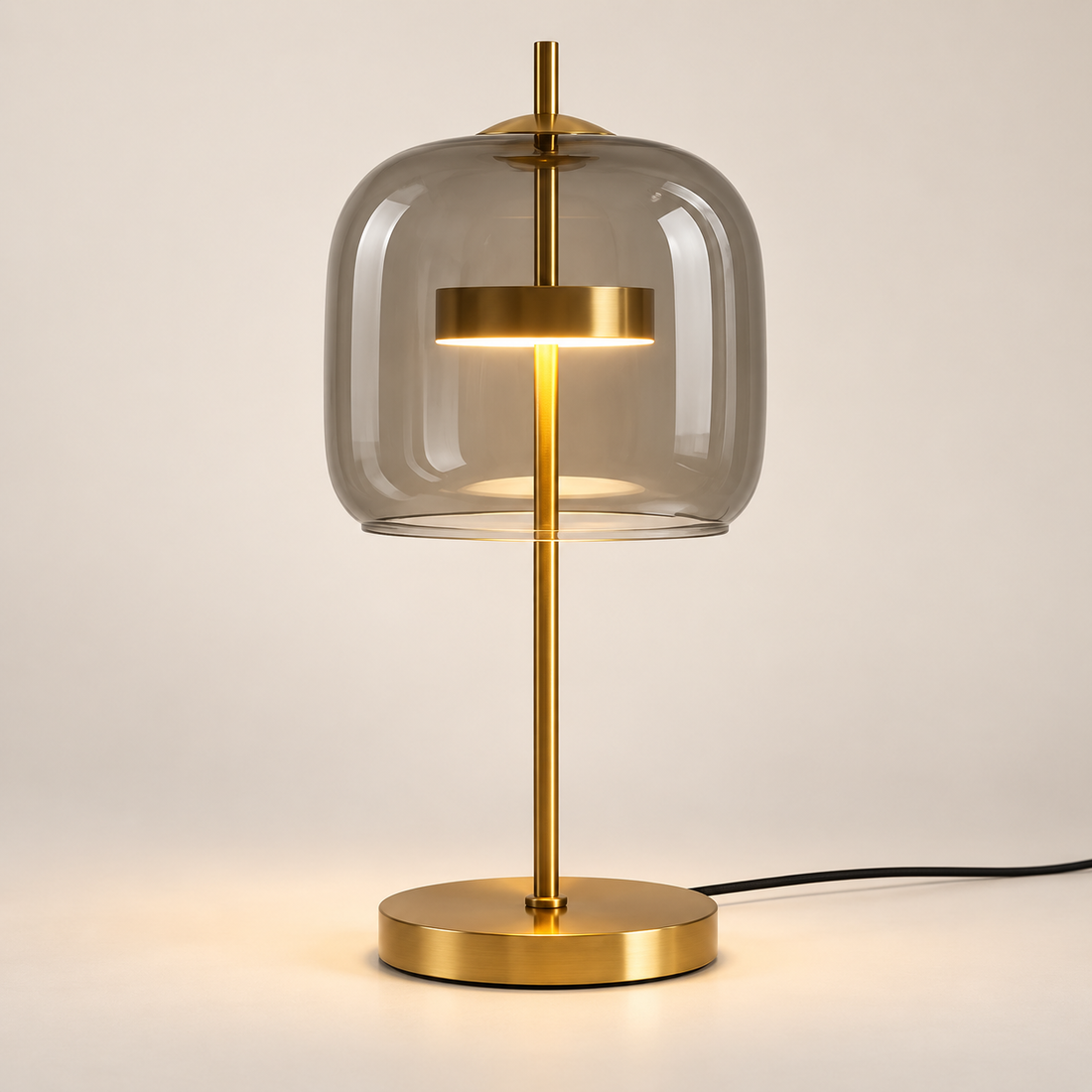 Aurelia Smoke Grey table lamp in warm-white mode on an ivory background