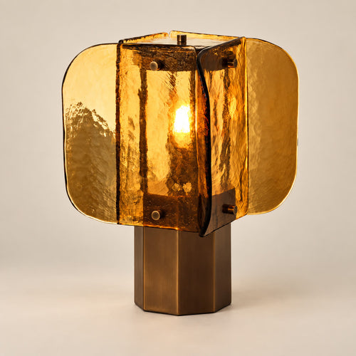 Amber antique glass art desk lamp on a warm neutral background