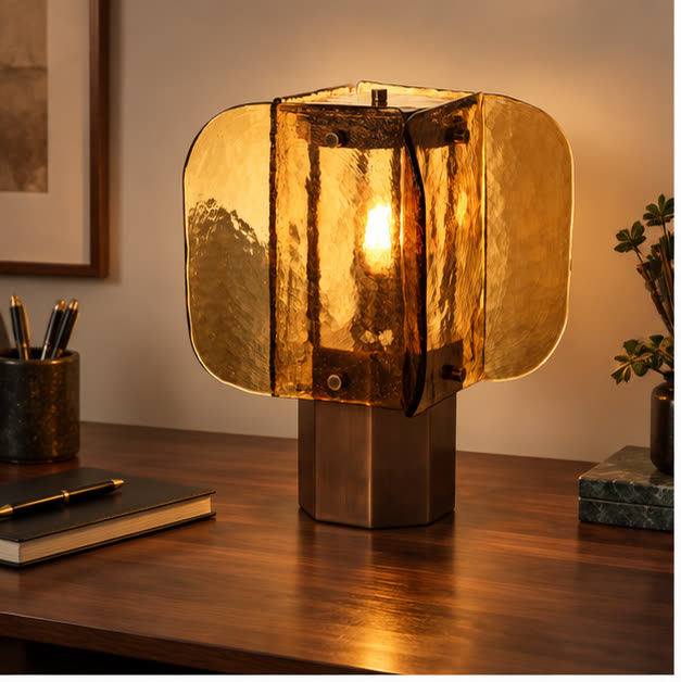 Amber glass desk lamp on a walnut writing desk