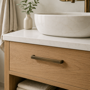Antique bronze drawer pulls fitted to an oak bathroom vanity
