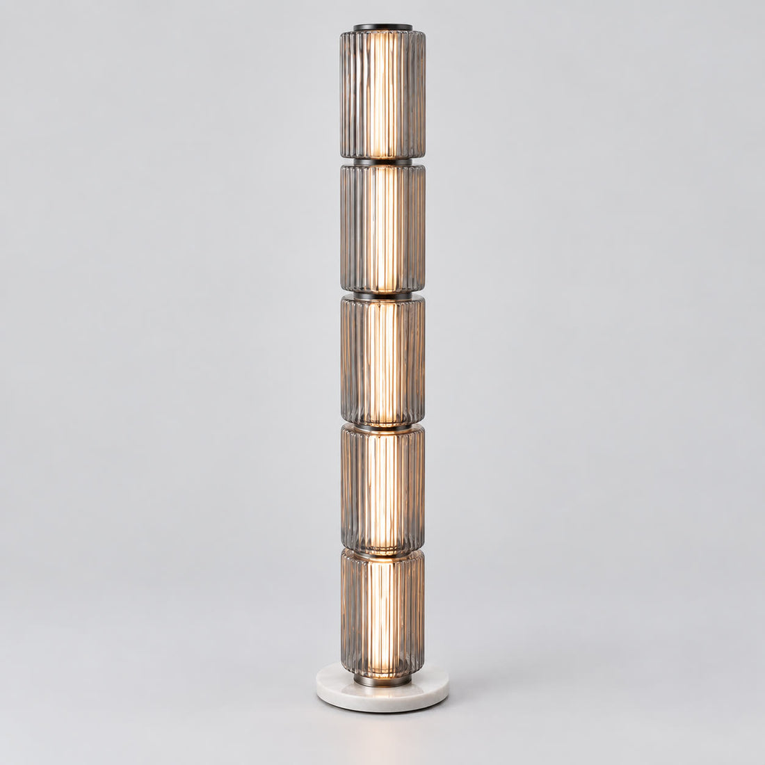Astra tall grey fluted-glass floor lamp on a warm neutral background