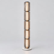 Astra tall grey fluted-glass floor lamp on a warm neutral background