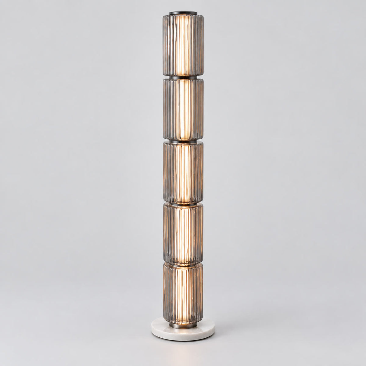 Astra tall grey fluted-glass floor lamp on a warm neutral background