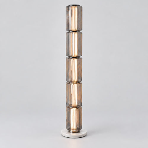 Astra tall grey fluted-glass floor lamp on a warm neutral background