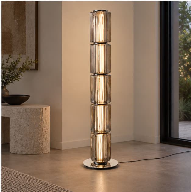 Three-quarter view of the Astra floor lamp and stone base