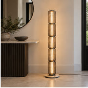 Astra floor lamp beside an entrance console