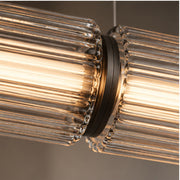 Fluted glass and black aluminium joint detail