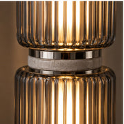 Close view of ribbed smoke glass and nickel joint