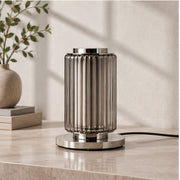 Astra grey glass table lamp in daylight, switched off