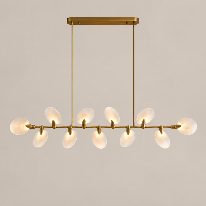Atelier Velmora ten-light linear chandelier on a warm neutral background