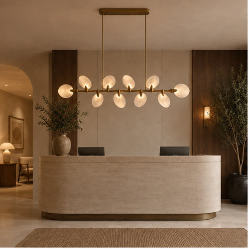 Atelier Velmora chandelier above a stone island