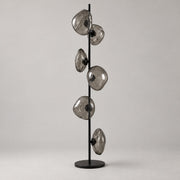 Rear three-quarter view of Auralis Black and Smoky Grey Glass Floor Lamp
