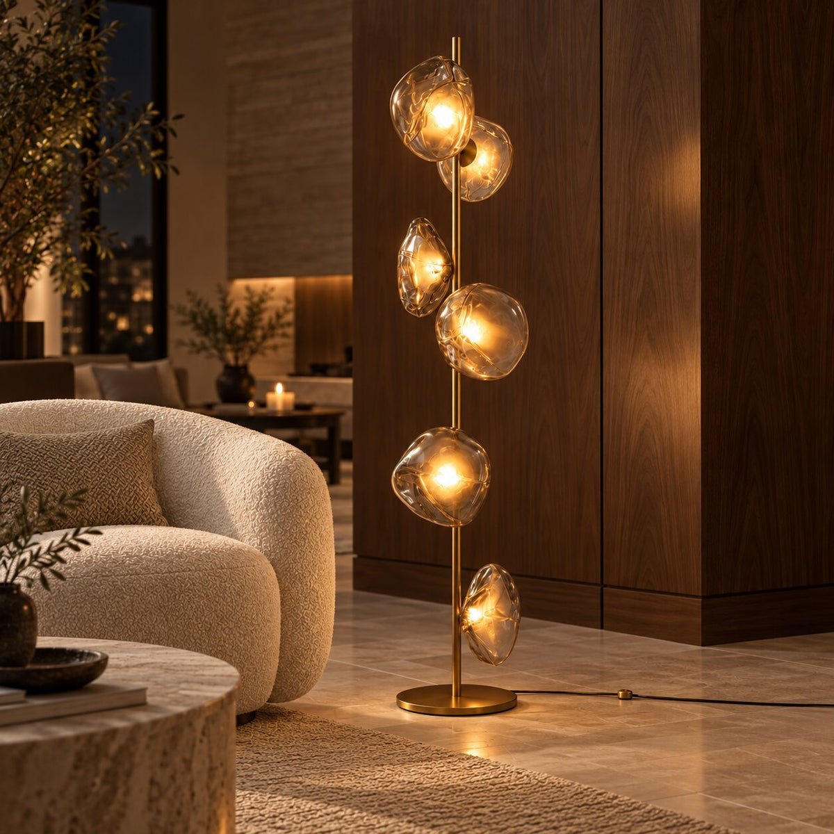 Auralis Gold and Transparent Glass Floor Lamp in a boutique hotel lounge