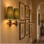Auralis dual khaki fabric wall lamp in a gallery hallway