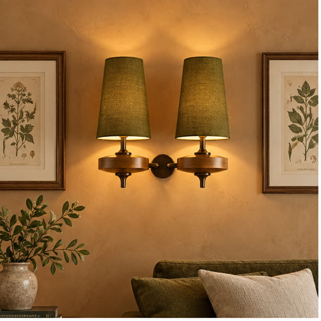 Auralis dual khaki wall lamps flanking living-room artwork