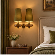 Auralis dual khaki wall lamp in a hotel bedroom