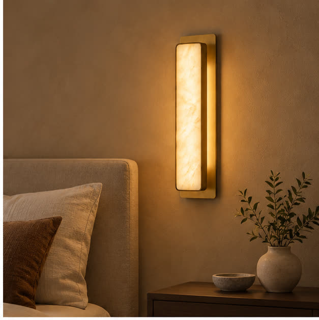 Auralis marble wall light beside a bed