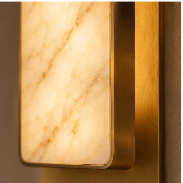 Natural marble veining and brushed brass edge detail