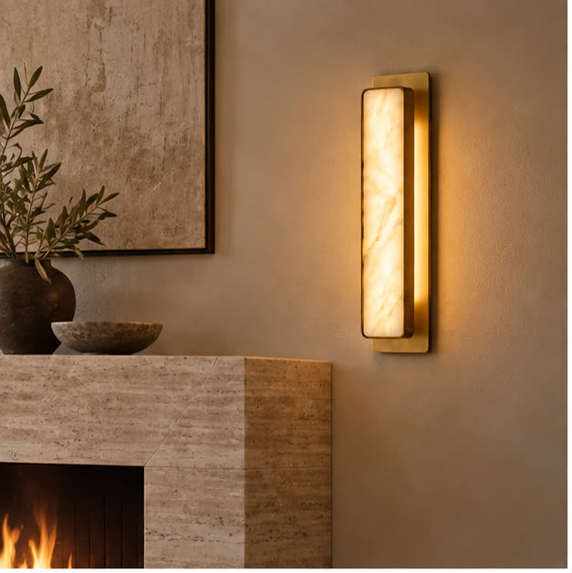 Auralis marble wall light beside a travertine fireplace