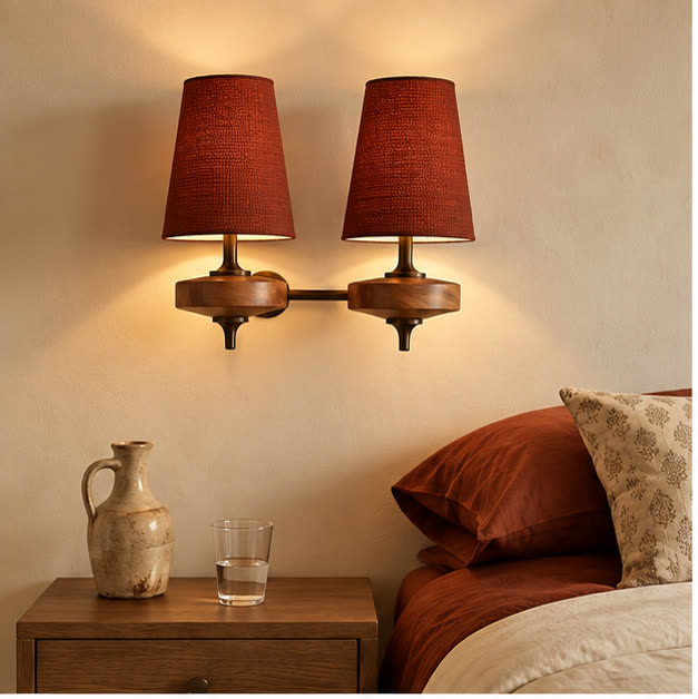 Auralis dual red wall lamp above a bedside table