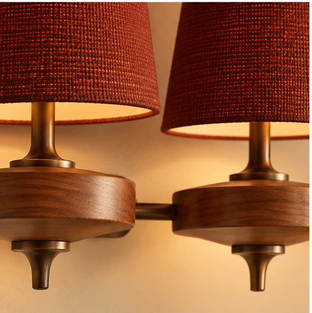 Deep red fabric weave, wood grain and bronze detail