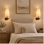 Pair of Auralis fabric wall lights beside a bed