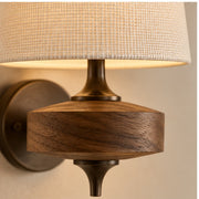 Close view of woven fabric shade and natural wood
