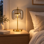 Aurelia Transparent glass lamp on a bedside table