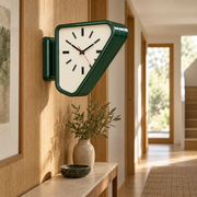 Forest green Aurelian dual-sided clock in a warm hallway