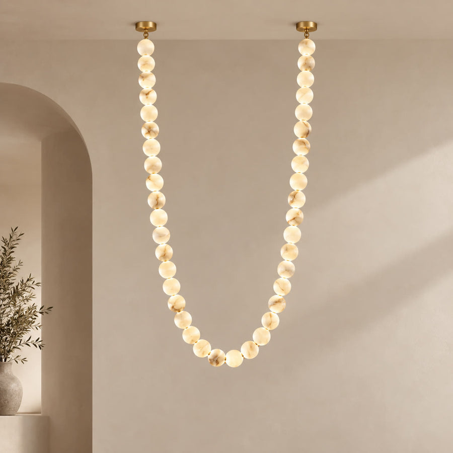 AuroMarble alabaster bead pendant in a cascading gold composition
