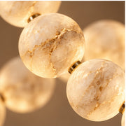 Close view of alabaster spheres and gold links