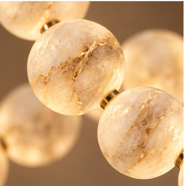 Close view of alabaster spheres and gold links