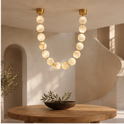 Compact AuroMarble pendant over a round table