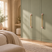 Blush pink BlushStone pulls on a sage fitted wardrobe