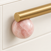Close detail of blush marble and satin brass on the BlushStone pull