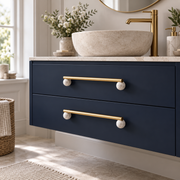 White marble BlushStone pulls on a navy bathroom vanity