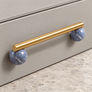 Blue marble BlushStone pull shown from the side for projection and grip