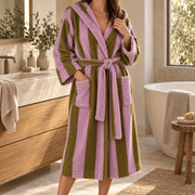 Pink and Brown Bold Stripe cotton bathrobe worn in a refined bathroom