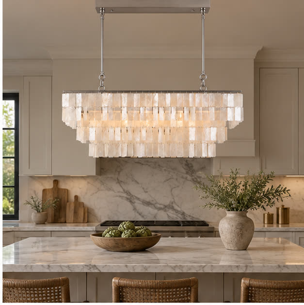 Capri linear chandelier over a marble kitchen island