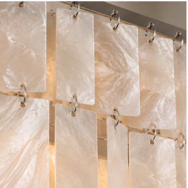 Close view of natural shell panels and metal rings