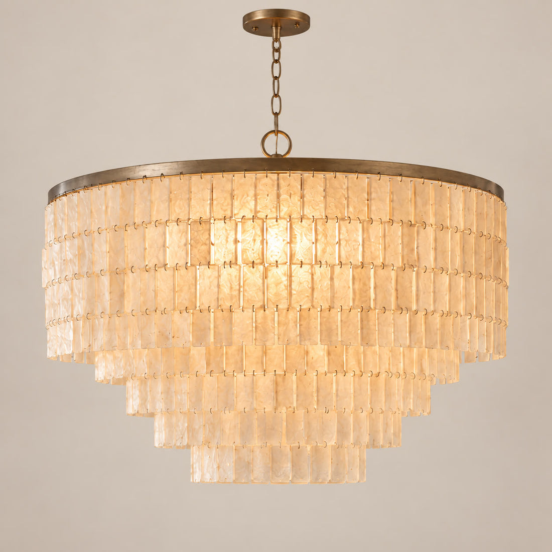 Capri round natural shell chandelier on a warm neutral background