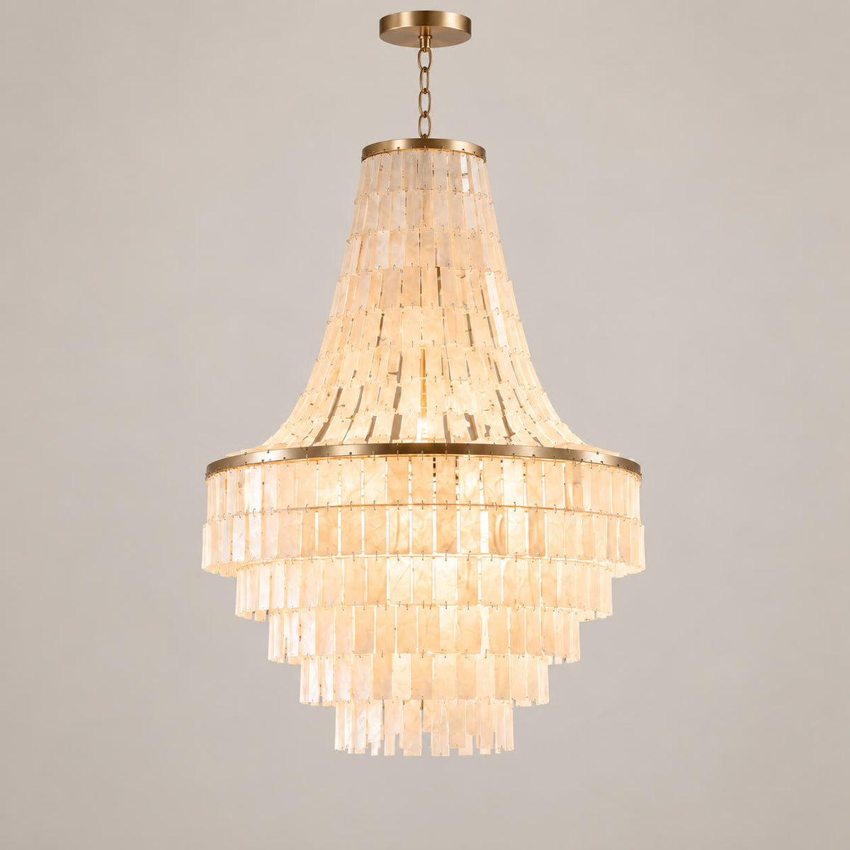 Capri large tiered natural shell chandelier on a warm neutral background