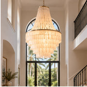 Capri tiered shell chandelier in a double-height foyer