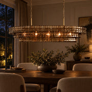 Dimmed warm Étoile chandelier in an evening dining room