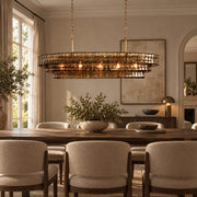Étoile grey glass chandelier above a dining table