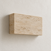 Unlit side view showing the Lumo wall light's stone depth