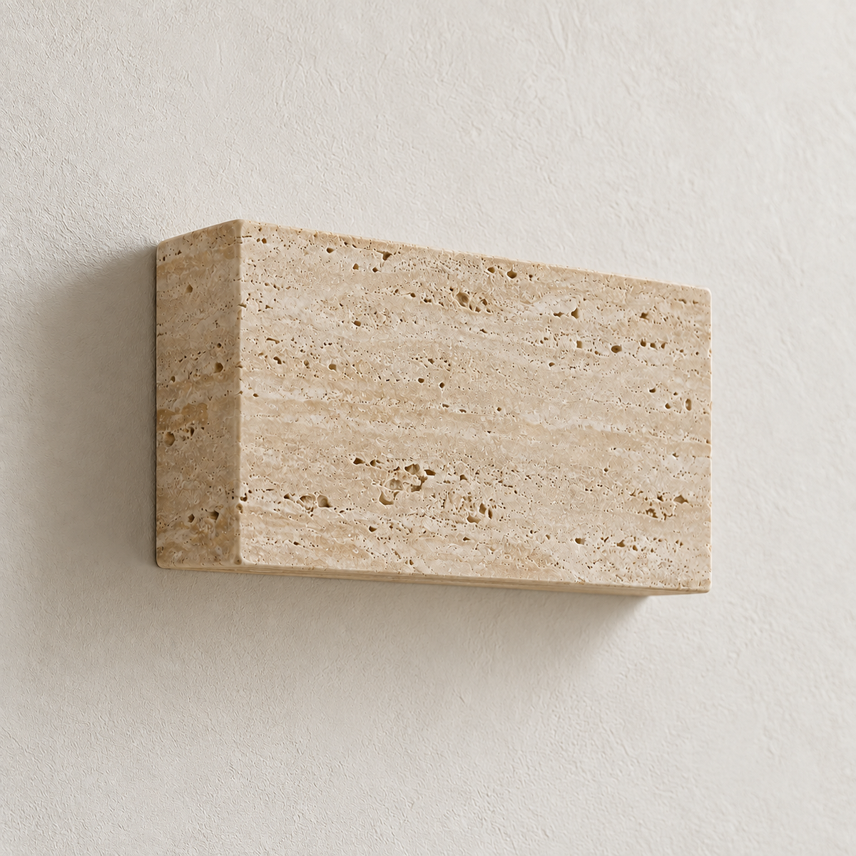 Unlit side view showing the Lumo wall light's stone depth