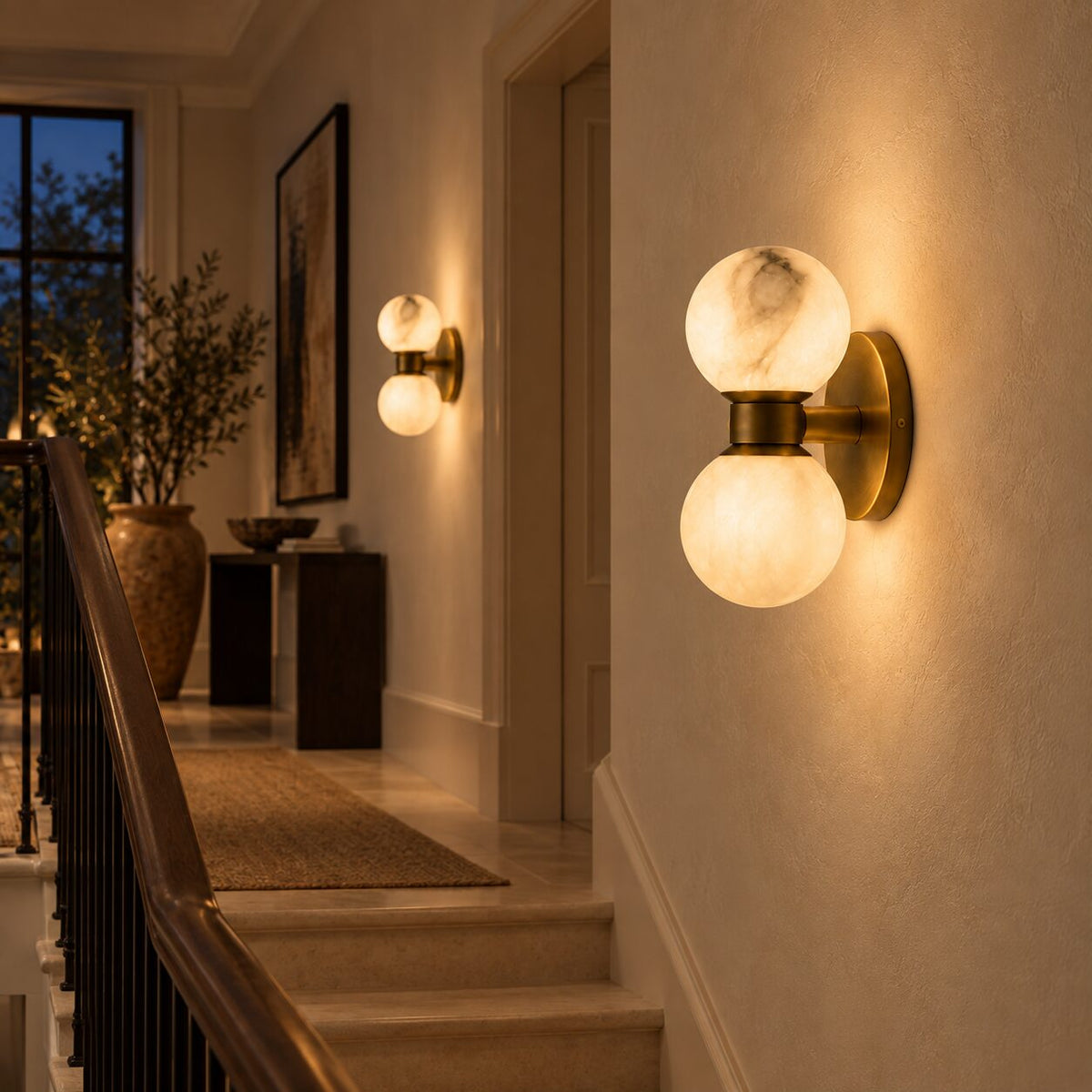 Lunara marble wall lamps along a stair landing