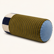 Sovana Olive Navy velvet neck-roll pillow on a warm neutral background