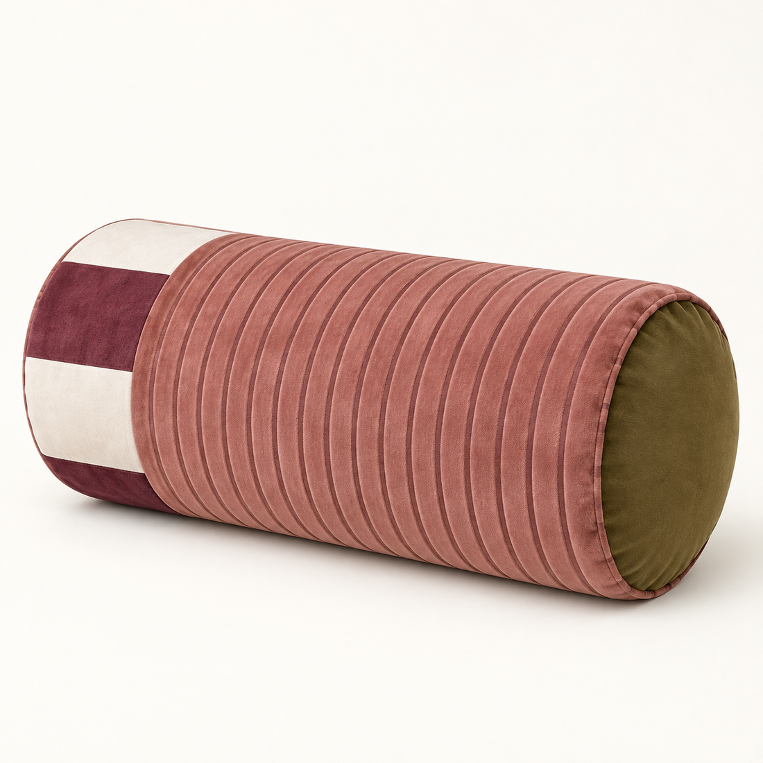 Sovana velvet neck-roll pillow in Rose Plum on a warm neutral background